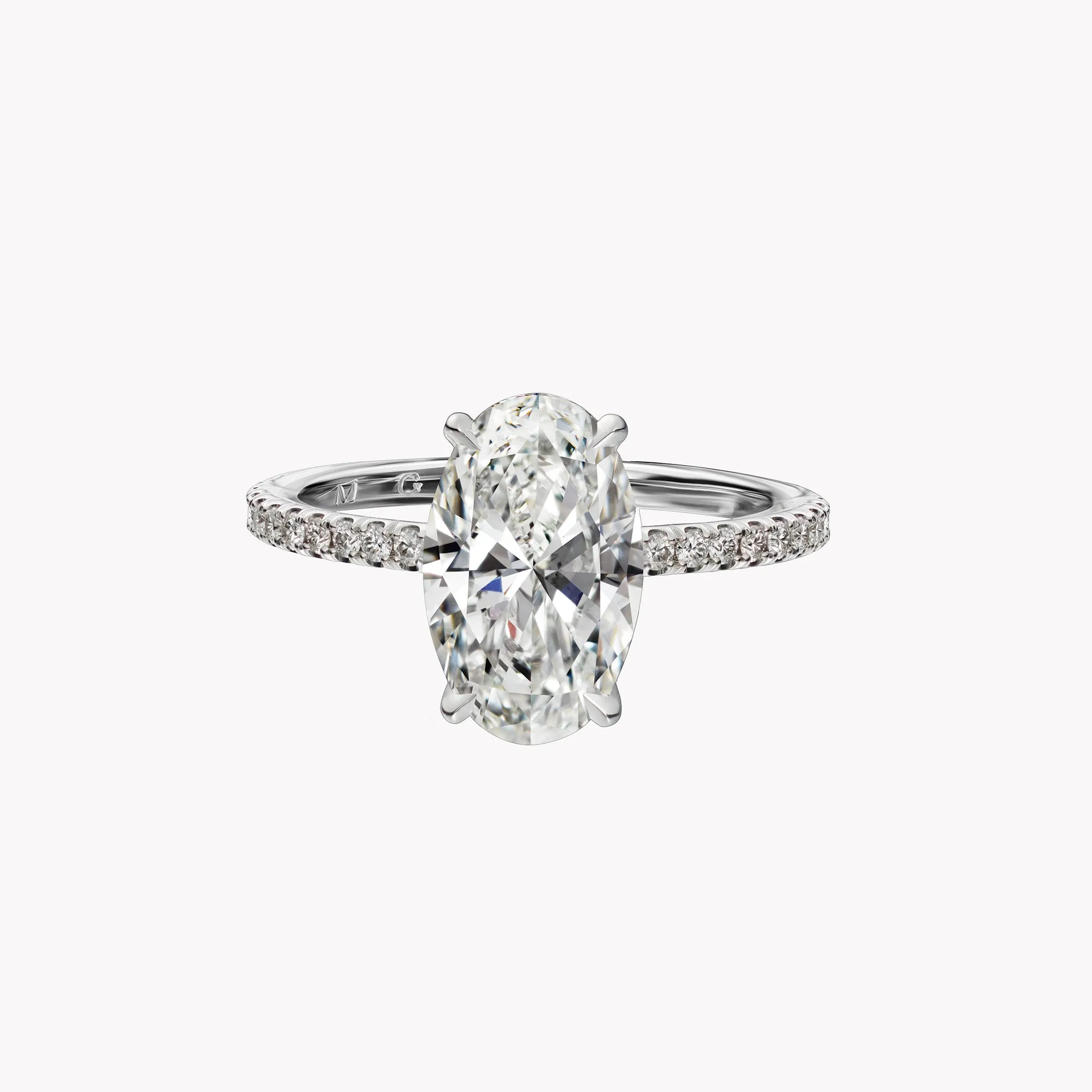 Oval Cut Solitaire Engagement Ring with Diamond Pavé